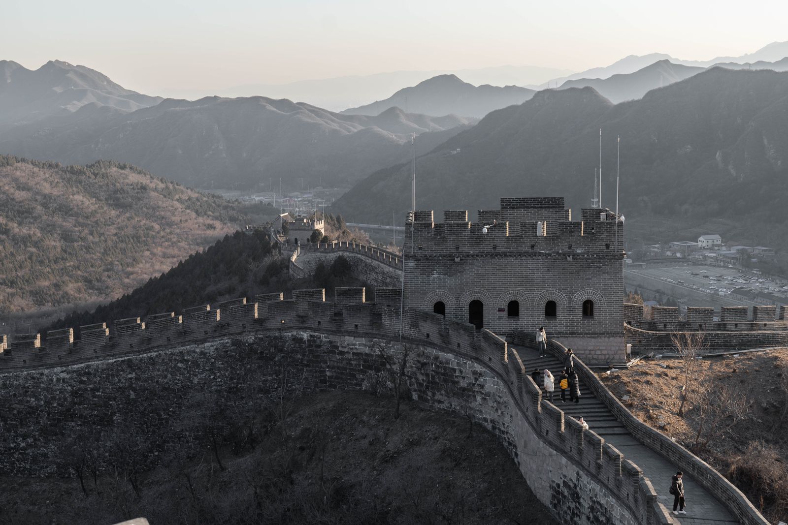 The Great Wall of China running along forested ridges