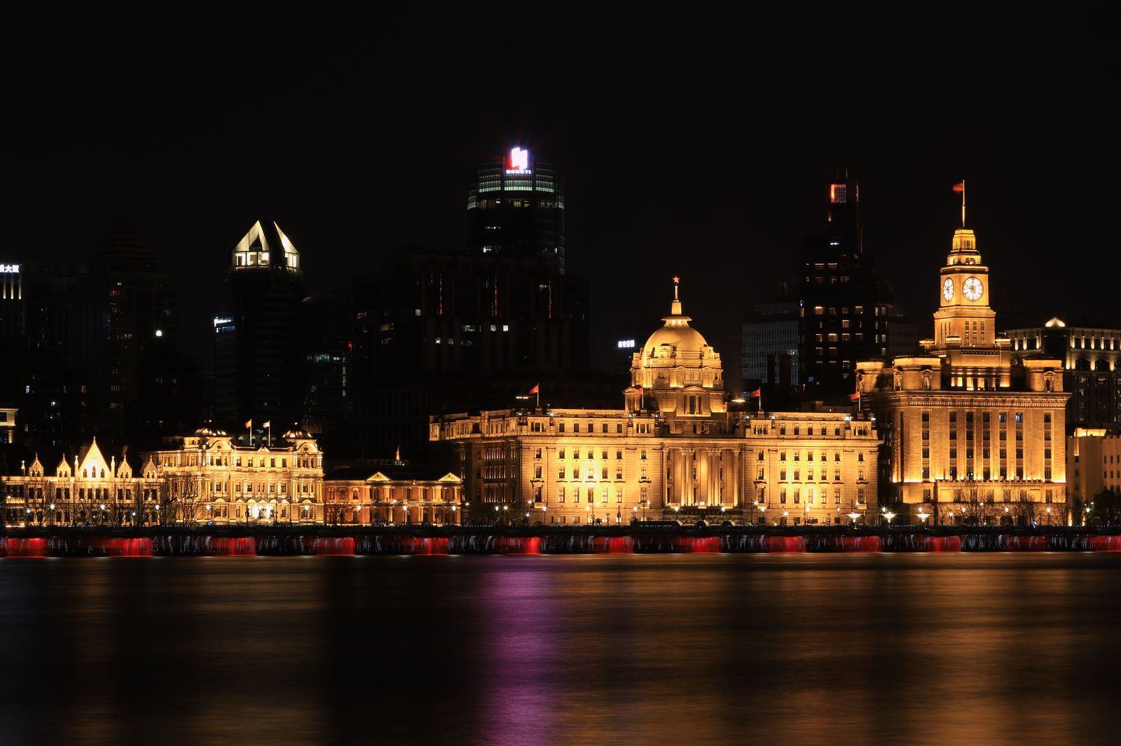 Shanghai skyline across the Huangpu River at dusk